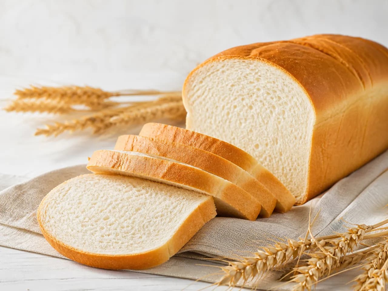 Finished sliced white sandwich bread with a fine uniform crumb