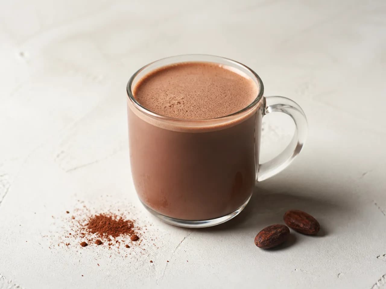 Finished instant cocoa beverage served in a clear glass mug